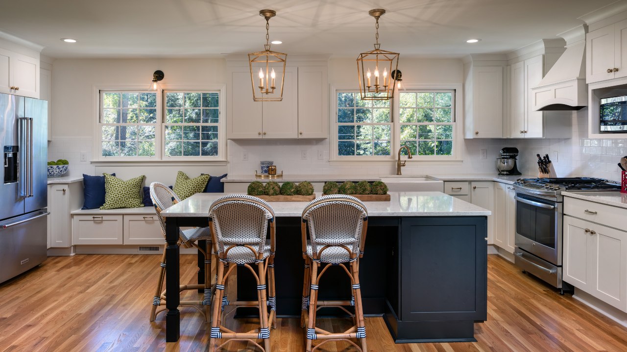 kitchen with white marble countertops and wooden floors