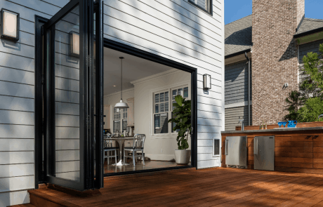 custom wooden patio with kitchen and grill