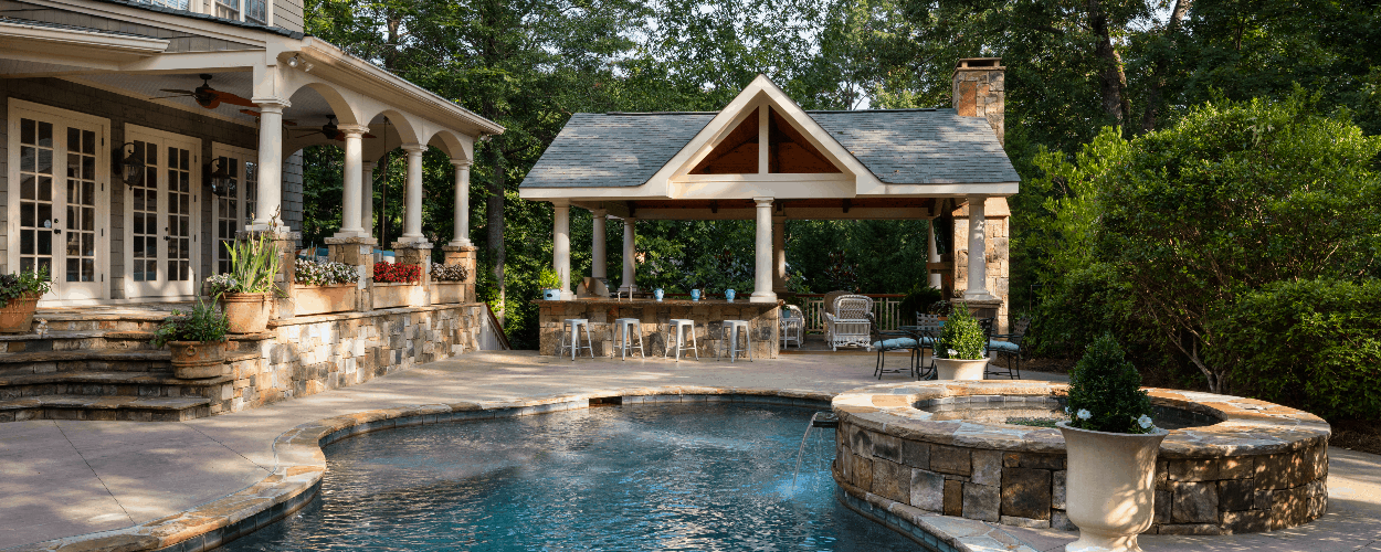 custom pool with outdoor patio