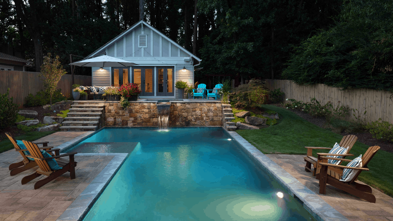 Custom pool design and backyard renovation in Atlanta includes a stunning, custom rectilinear swimming pool with irregular Tennessee gray flagstone coping
