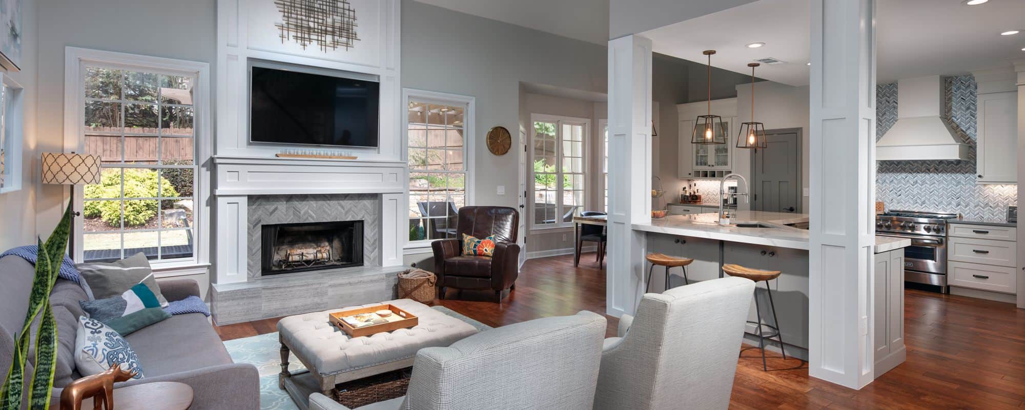 living room space with fire and open concept kitchen
