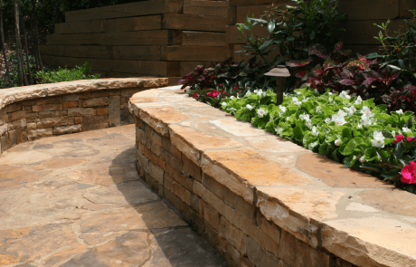 Outdoor stone walkway with custom lanscaping