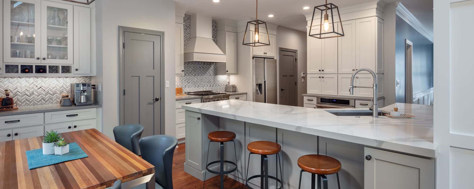 Stylish Modern Kitchen with marble countertops and wooden dinning table