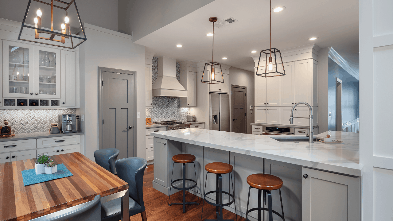 remodeled kitchen with white countertops and wooden floors