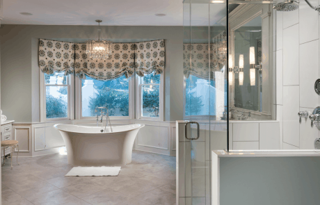grey and white master bath remodel features a large walk-in glass surround shower
