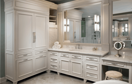 custom-built single sink vanity with makeup counter features white Italian marble countertops