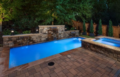 back lit pool with waterfalls