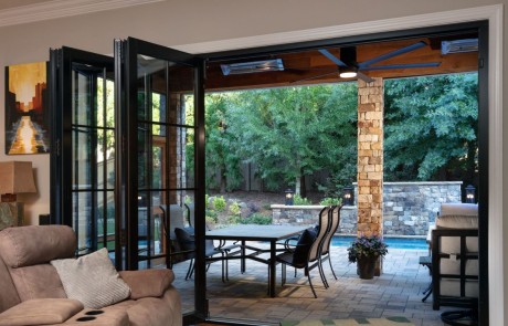 panoramic doors give the homeowners a seamless transition for indoor-outdoor living
