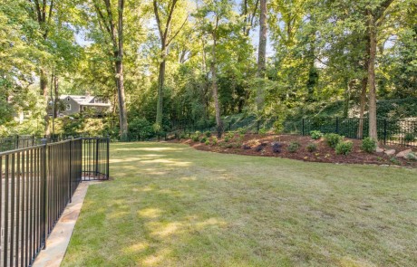 large backyard with green lush grass