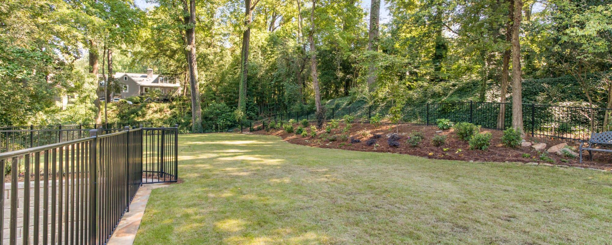large backyard with green lush grass