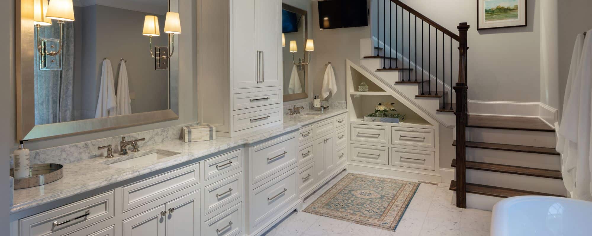 bathroom with white marble countertops and white cabinets