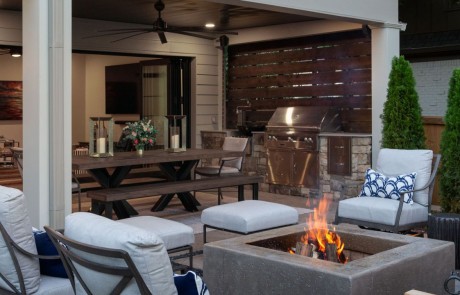 patio with six chairs and wooden fireplace
