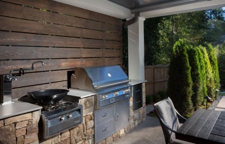 outdoor patio kitchen with grill and stove