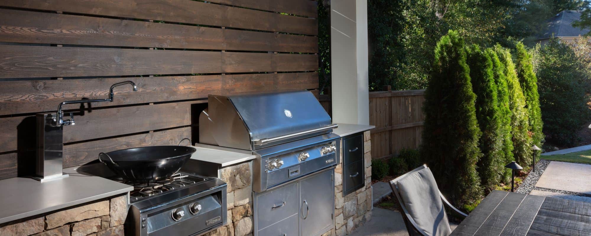 outdoor patio kitchen with grill and stove