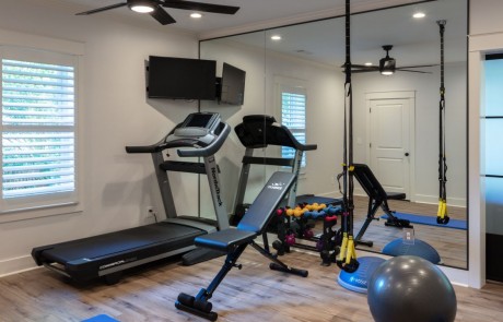 Basement with Private Home Gym and Floor to Ceiling Mirrored Walls.