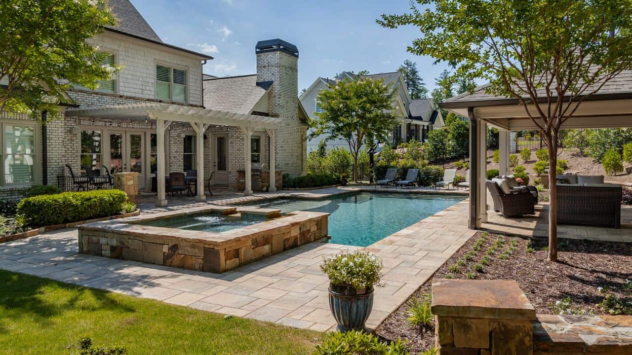large backyard with pool and jacuzzi
