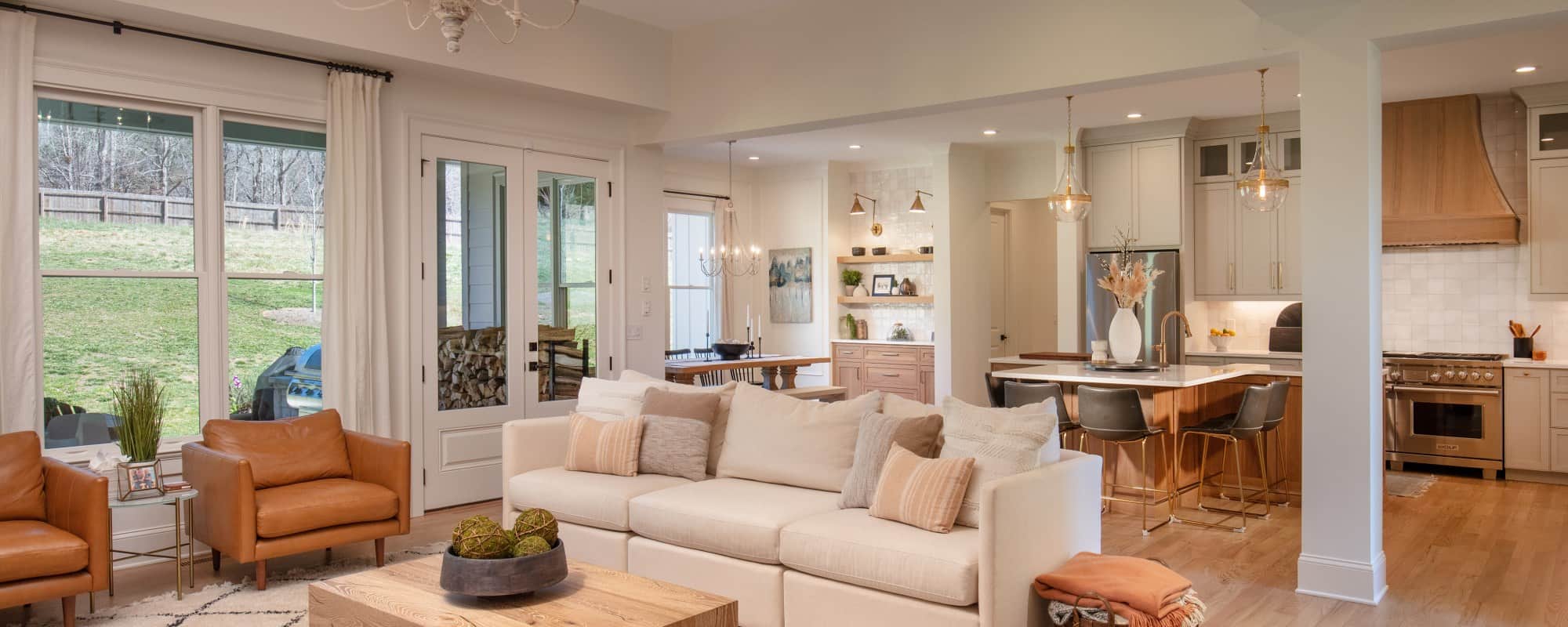 spacious living with white and beige sofas