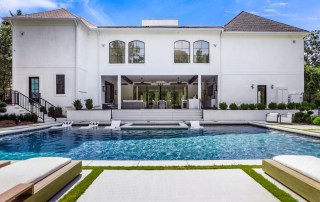 custom home with custom pool and in-water in-pool furniture