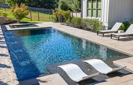 Luxury swimming pool installation & outdoor pool entertainment area with knife edge perimeter overflow spa.