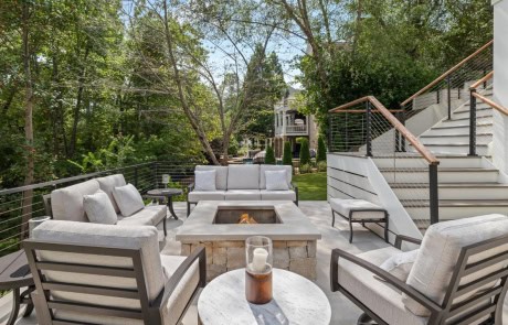 Ray-10-Gallery Luxury outdoor fire pit lounge with modern seating beside infinity-edge pool and patio by Boyce Design + Build in Duluth, Georgia.