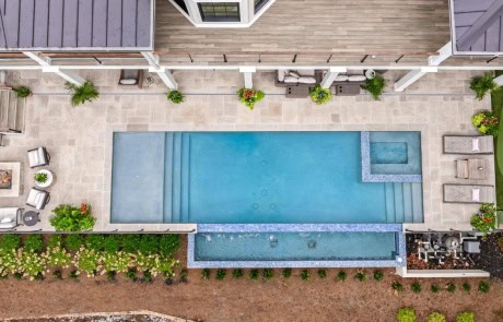 Ray-59-Gallery Aerial view of multi-level backyard with pool, spa, fire pit, and putting green.